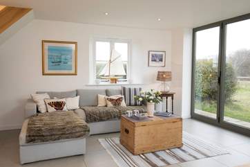 The living/dining area is an extension to the original cottage, with modern under-floor heating.