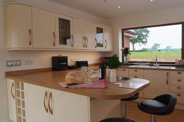 Lakeview House has an amazing spacious contemporary kitchen with a breakfast bar.