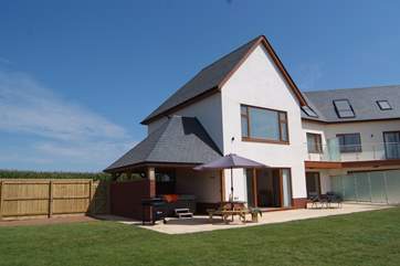 Lakeview House and Lakeside House are semi-detached. There are privacy glass panels close to the house and then fencing between the two gardens.