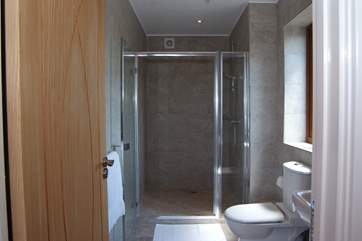 The walk in shower is supersize with a drench shower head. What a treat.