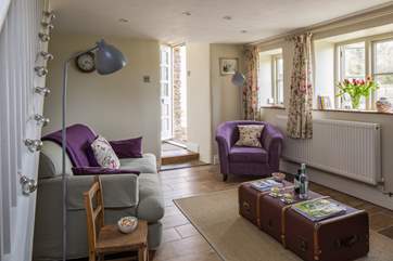 The comfy sitting-room with a small step up to the front door, bathroom and kitchen.