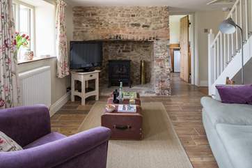 The sitting-room has a fabulous inglenook fireplace, with wood-burner effect electric stove, the thatch does not permit an open fire.