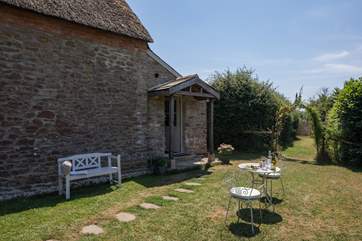 The tranquil and private garden is behind the cottage and the entrance to the boot/utility-room.