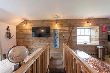 Up the stairs, left to the sitting-area, right to the kitchen/dining area.