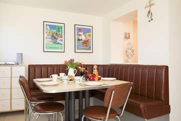 Designed with a retro feel, the dining-area with seating for eight has patio doors out to the garden to open up on those sunny days.