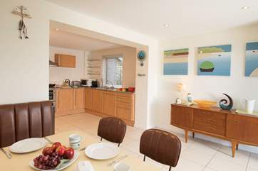 The open plan kitchen/dining-room is a fabulous, large and light space for entertaining whilst preparing meals.