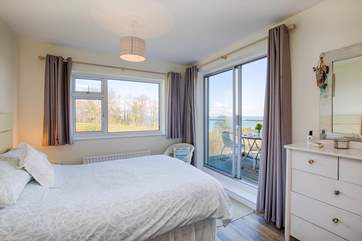 Wake up in a generous king-size bed admiring that wonderful view.