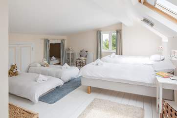 The family room is the perfect bedroom for the younger members of the party. They can get a restful night's sleep away from the festivities of the main house, as they are on the second floor.