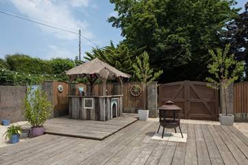This fabulous little hut provides the perfect spot for your barbecue food and drink.