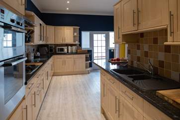 From the entrance porch/boot room, you step into this lovely kitchen.
