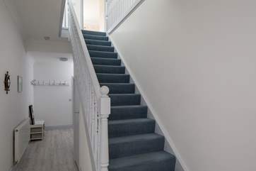 The hallway stairs lead up to the first floor bedrooms and bathrooms.