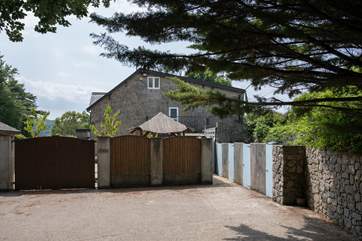 Once parked, the entrance gate to Firwood is just to the right of the wooden doors.