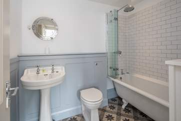 En suite to bedroom 1 boasts this rather lovely roll-top bath.
