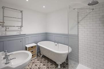 The en suite to bedroom 2 is home to a stunning roll-top bath and shower cubicle.