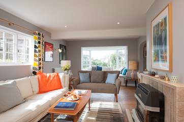 The dual aspect living-room has access and views overlooking the garden.