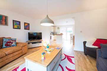 A view from the sitting-area through to the kitchen and dining area.