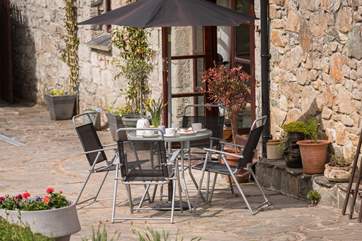 The pretty courtyard all ready for coffee.