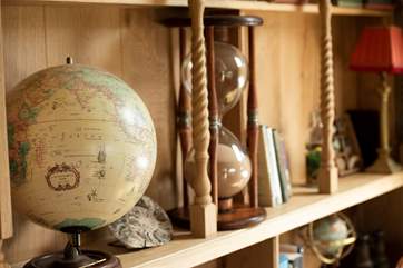 There is a cornucopia of cosmic antiques and artefacts displayed on the shelves.