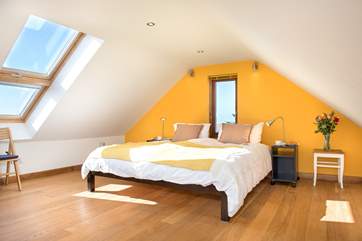 The light floods into Bedroom 3 on the second floor, which has a super-king size bed.