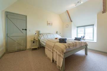 The simply-styled master bedroom is a calm and peaceful retreat after a busy day exploring.