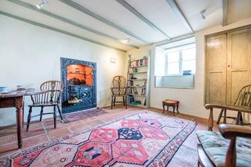 The dining-room houses an ornamental Cornish range.