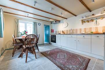 The kitchen/diner leads out to a pantry.