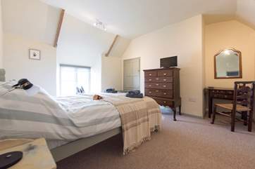 The simply-styled master bedroom is a calm and peaceful retreat after a busy day exploring.
