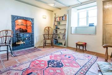 The dining-room houses an ornamental Cornish range.