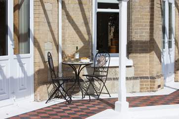 Take a seat on the sunny veranda as the evening draws in with a glass of wine