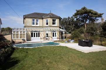 Step out of the pool and straight to the outdoor table and chairs where you can enjoy dinner in the sunshine