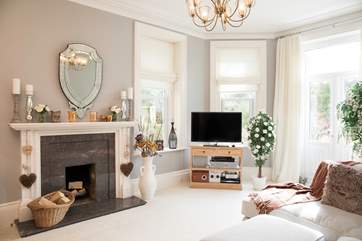 The elegant sitting-room is a beautiful space to relax in