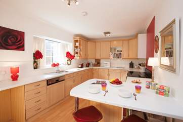 The large kitchen gives you plenty of space to prepare, cook and eat at the breakfast bar