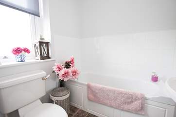 Fill the bath and pour in the bubbles for a relaxing soak in the bath in the family bathroom