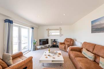 The roaring fire in the comfortable sitting-area.