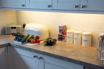 Prepare a family meal in the well equipped kitchen.