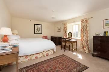This is the master bedroom - facing to the front of the Barton with views over the gardens and the valley beyond.