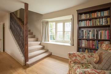 A grand staircase leads to the first floor bedrooms and bathrooms.