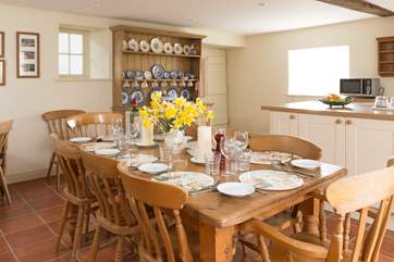 The kitchen is tiled throughout. The back door - your initial entrance door - is in the far right corner of the room.