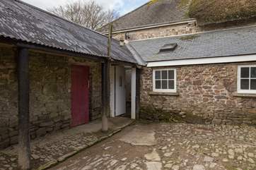 This is the entrance that you will use on arrival. The red door leads to your own little barn and the white door to the covered boot room area.
