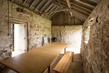 Just off the courtyard, next to the covered boot room area is this lovely stone barn for you to use as you wish. This barn also leads out to your garden.