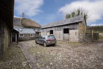 The cobbled courtyard with plenty of parking space dedicated to guests at the Barton.