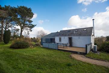 Relax on the private terrace overlooking the garden and fields beyond.