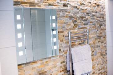 There is cosy under-floor heating and a heated towel rail.