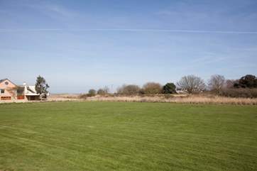 Children are sure to enjoy the expansive communal grounds at Tollgate cottages.