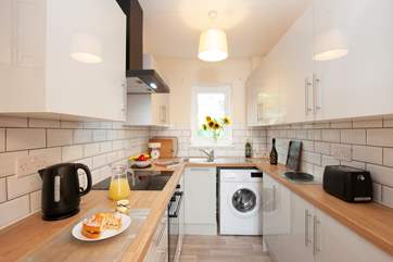 A pleasant kitchen boasts all the modern conveniences.