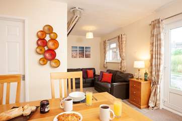 The open plan living/dining area is bright and inviting.