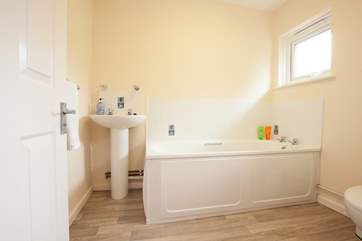 There is a bright, modern bathroom on the ground floor.