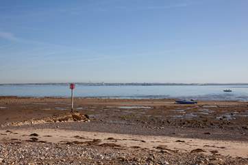 The beach directly in front of Tollgate Cottages is a mixture of sand and stone, popular with walkers.