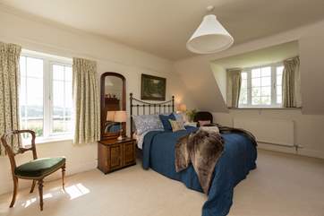 This is the master bedroom. It is really spacious and has loads of storage space.