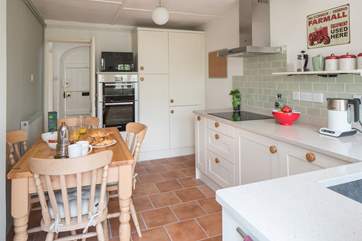 The bespoke kitchen/dining-room has all brand new appliances including an induction hob.